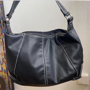 Black bag with white stiching