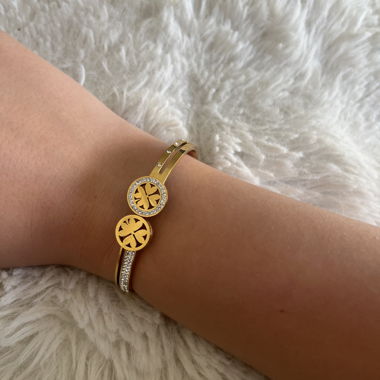 Bracciale dorato con motivo floreale