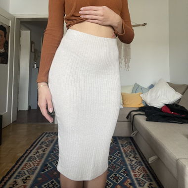 Snug fit medium length beige skirt