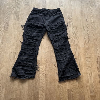 Black flared distressed denim
