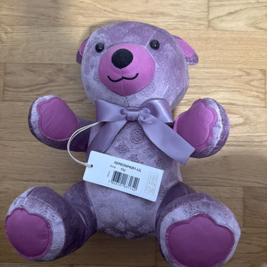 Lila Guess Plueschteddy mit Schleife