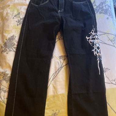 Black jeans with white embroidery