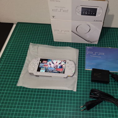 Psp in box with games installed [in OVP,]