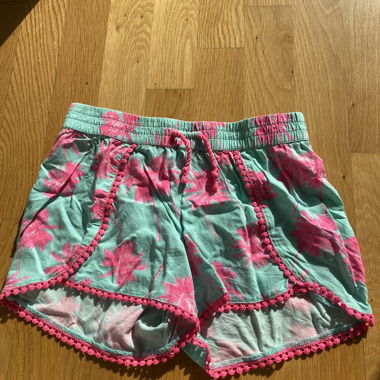 Short turchese con palme rosa