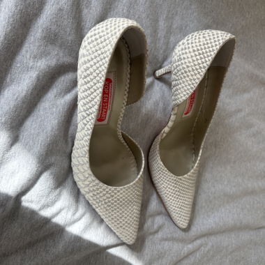 Décolleté beige con motivo serpente