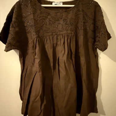 Brown top with blue floral details