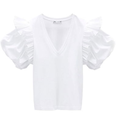 Top bianco con maniche a sbuffo