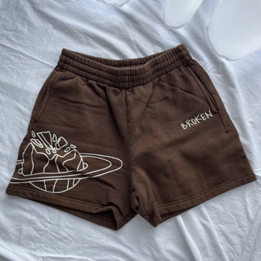 shorts in felpa marrone „broken planet“