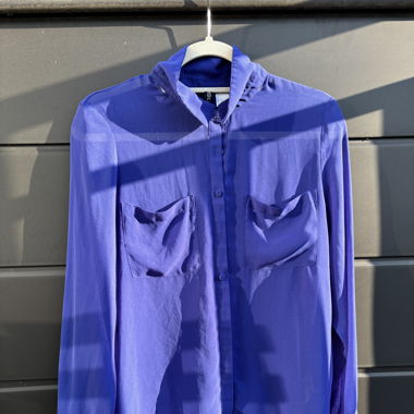 Slightly transparent blue blouse