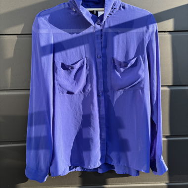 Slightly transparent blue blouse