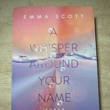A whisper around your name by Emma Scoot