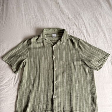 Green short-sleeve button-up shirt