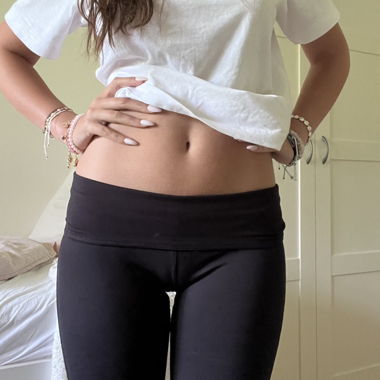 Leggings neri a vita bassa con risvolto e svasati