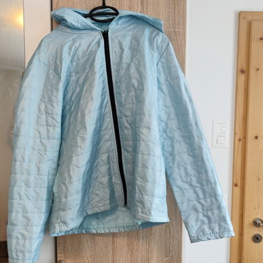 Light blue quilted hooded jacket