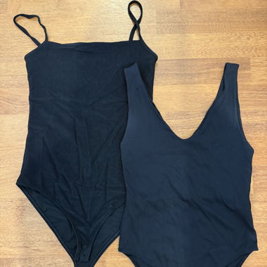 2 black bodysuits