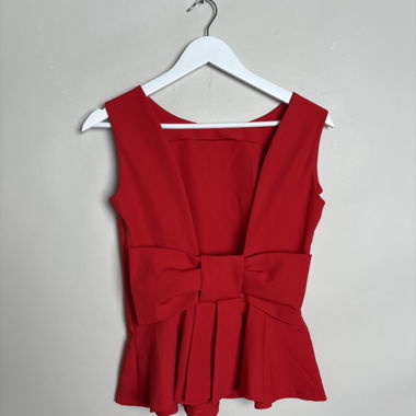 Red sleeveless peplum top