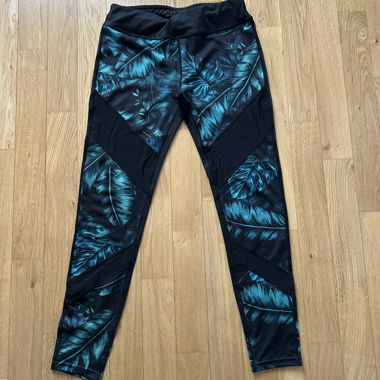 Leggings de sport noirs avec motif de feuilles turquoise