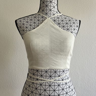 white crop top with long strings in the back