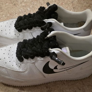 Nike sneakers with replaceable laces included