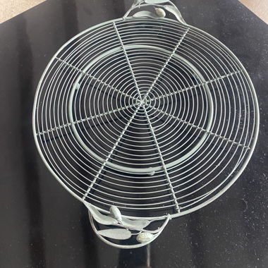Sottopentola rotondo in metallo decorativo