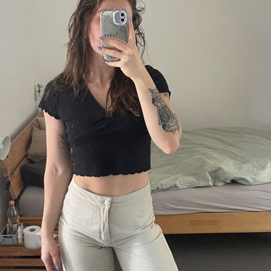 Pantaloni a zampa beige a righe
