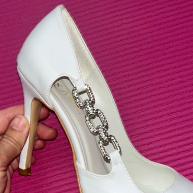 White high heels with rhinestone chain