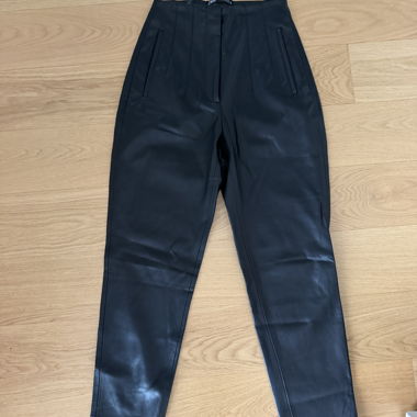 Black faux leather trousers