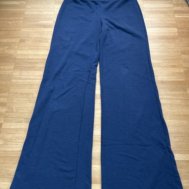 Blue low-waist sweatpants with star appliqués