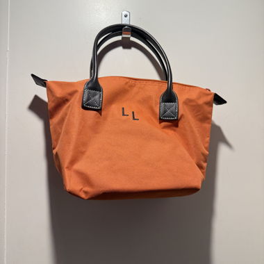 Orange Handtasche mit Henkeln
