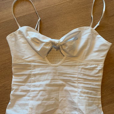 White spaghetti-strap top with bow