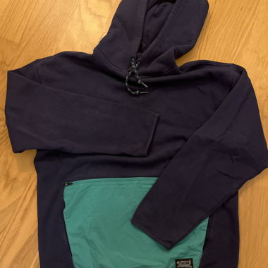 Navy hoodie with teal front pocket
