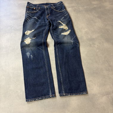 Jeans Levi’s 702 distressed