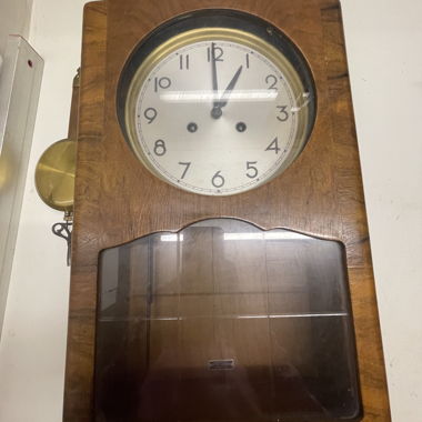 Ancienne horloge à pendule en bois