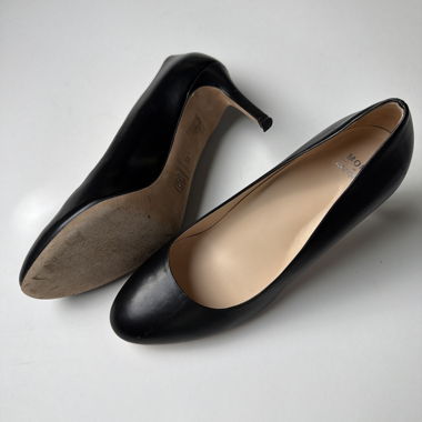 Black leather pumps