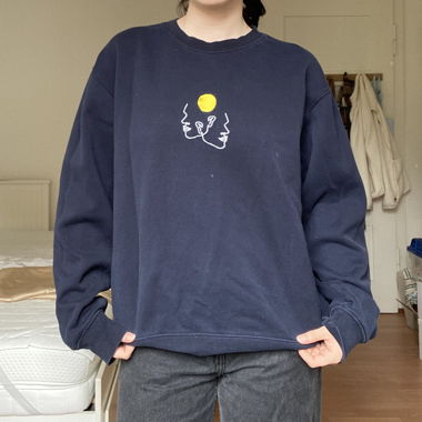 blue sweater with stitching