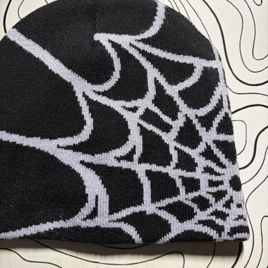 Black beanie with spider web pattern