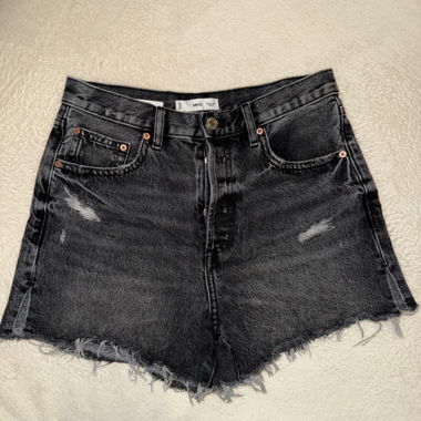 Black denim shorts with frayed hem