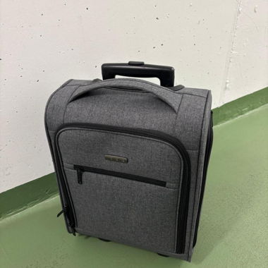 Grey carry-on trolley suitcase