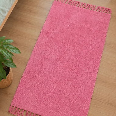 Tapis rose à franges