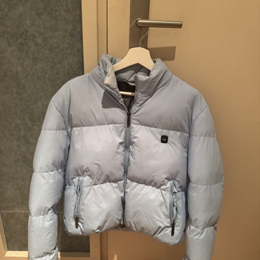 Light blue heated quilted jacket with power bank