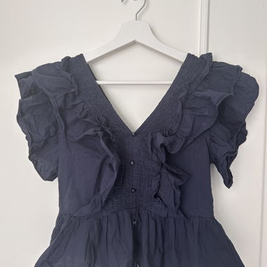 Ruffled navy blouse