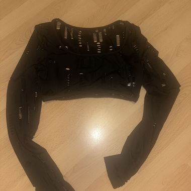 Black long-sleeve crop top with cut-outs
