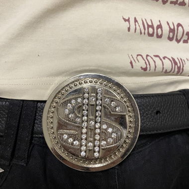 Belt buckle spinning dollar