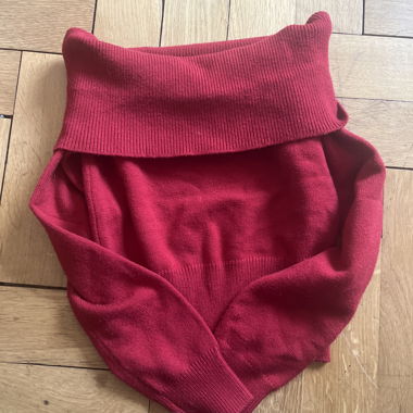 Red knitted sweater with wide turtleneck