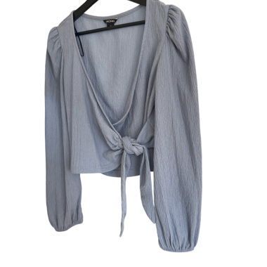Light blue blouse with front tie knot