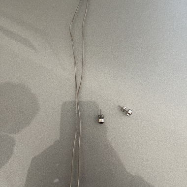 Silver-colored necklace with stone pendant