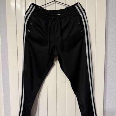 Adidas black training pants with snap buttons