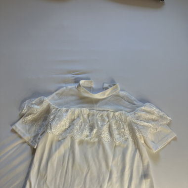 white blouse with lace accents