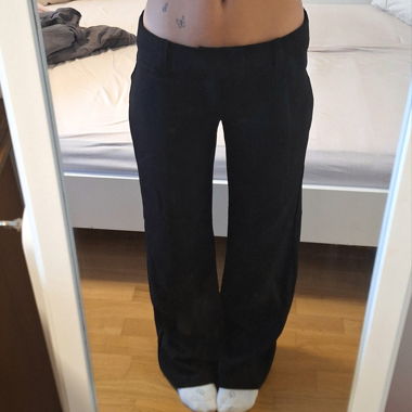 Low waist black fabric trousers