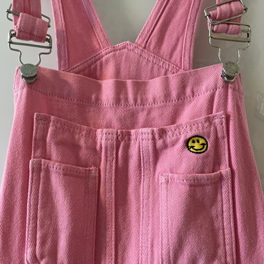 Salopette rosa con Smiley